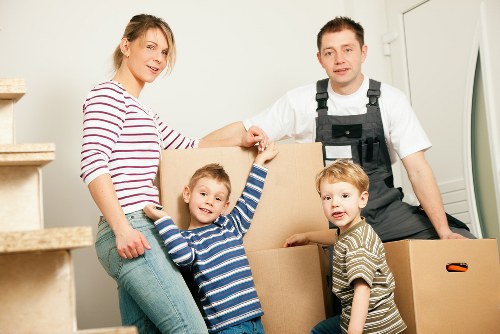 Man with van removal service in Bigginhill loading household furniture