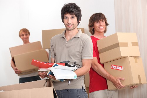 Local removals team planning a move in a Bigginhill residential street
