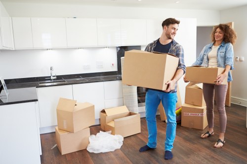 Commercial removal team moving office equipment in Bigginhill