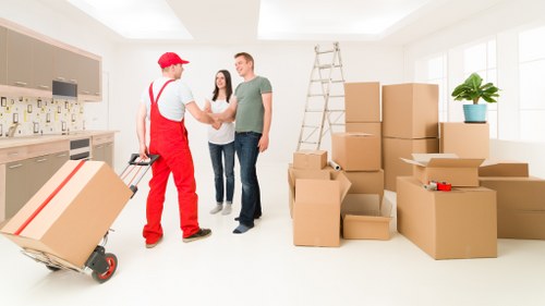 Removal crew loading household items with care