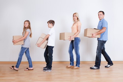 Removal crew loading crates and office items for a business relocation